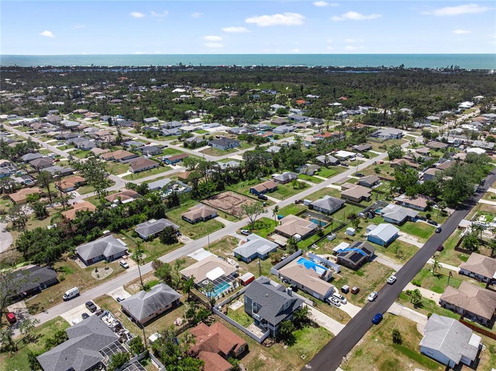861 Nectar Road Venice, FL 34293 - Photo 65 of 75 an aerial view of residential houses with outdoor space
