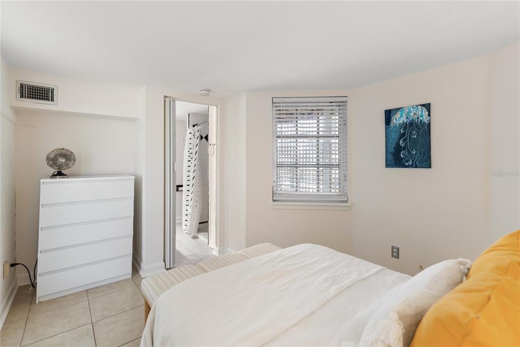 861 Nectar Road Venice, FL 34293 - Photo 69 of 75 a bedroom with a bed and cabinet