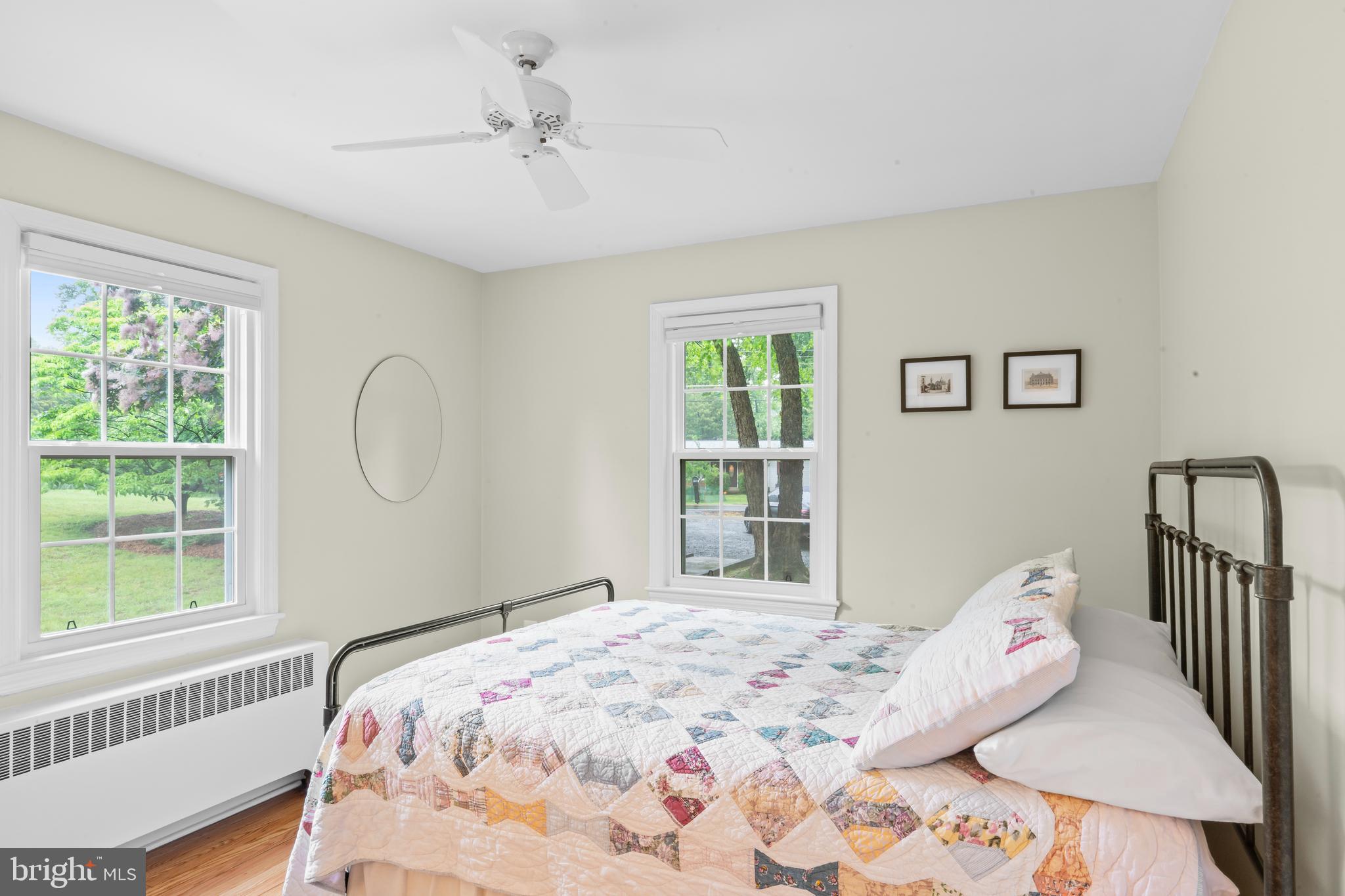 12131 Waples Mill Road Oakton, VA 22124 - Photo 7 of 40 a bedroom with a bed and a window