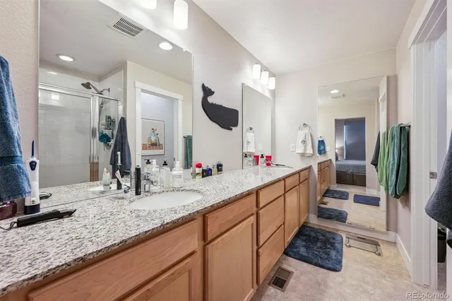 a bathroom with sink and mirror