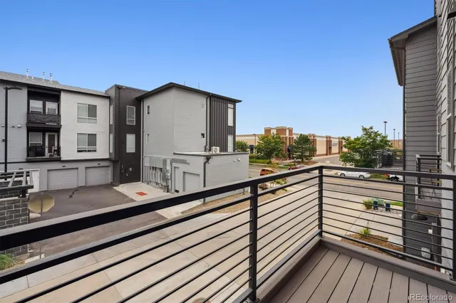 a view of a two chairs in the balcony