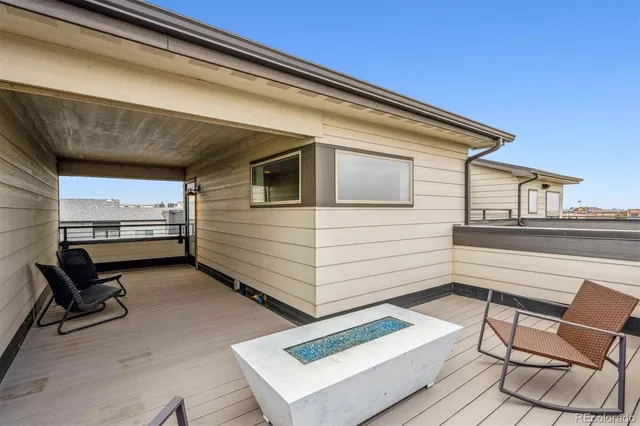 a view of a two chairs in the balcony