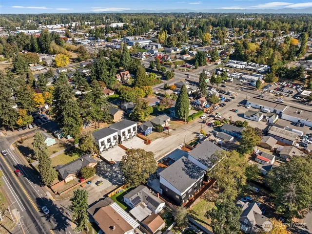 an aerial view of residential building with parking