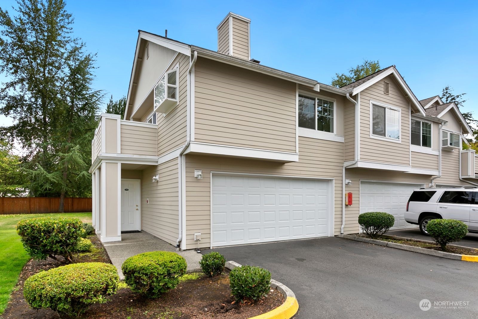 1522 196th Street Southeast, Unit C102 Bothell, WA 98012 - Photo 1 of 15 a front view of a house with garden