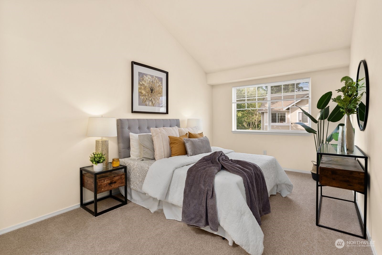 1522 196th Street Southeast, Unit C102 Bothell, WA 98012 - Photo 12 of 15 a bedroom with a bed and a potted plant