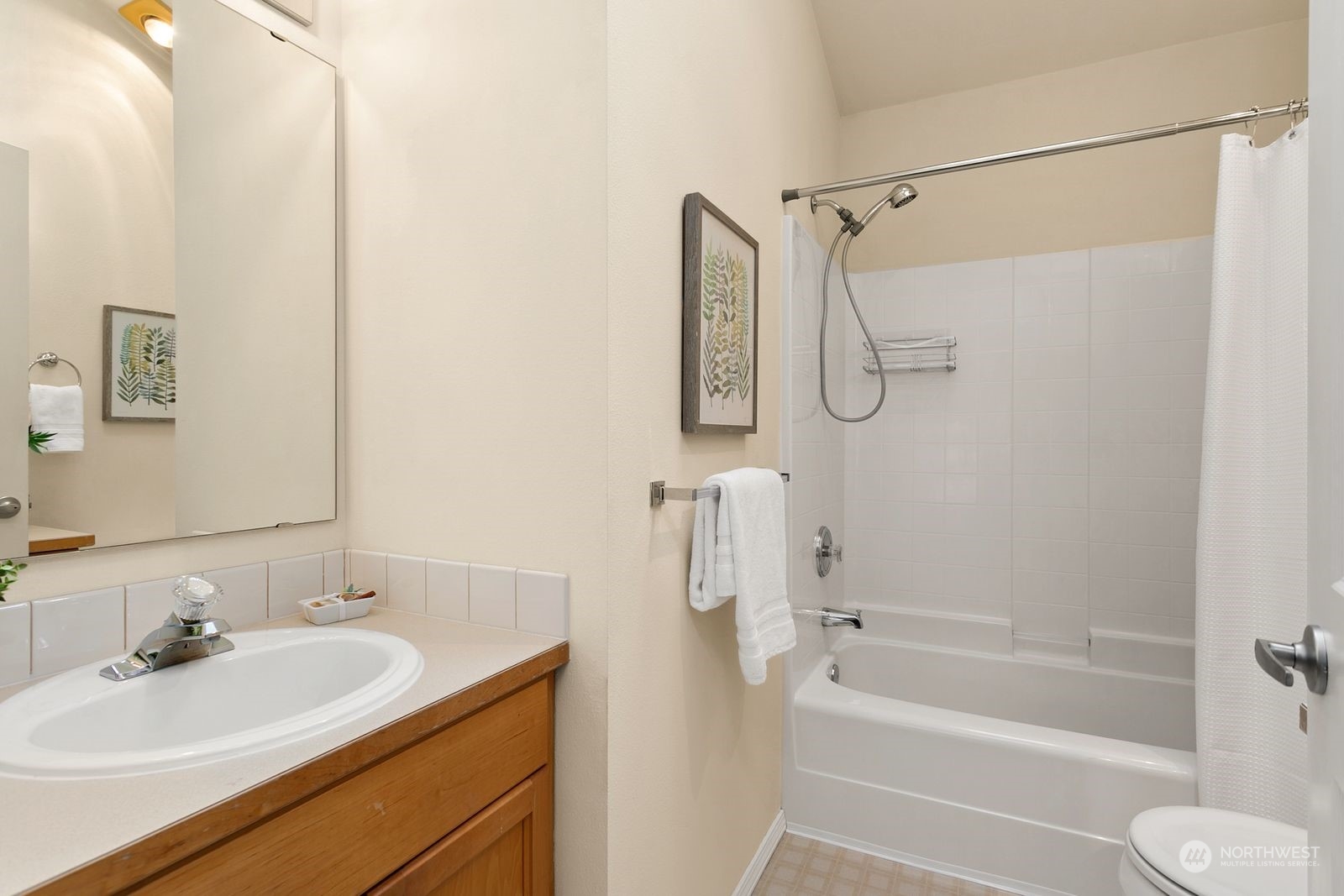 1522 196th Street Southeast, Unit C102 Bothell, WA 98012 - Photo 14 of 15 a bathroom with a granite countertop sink a toilet and shower