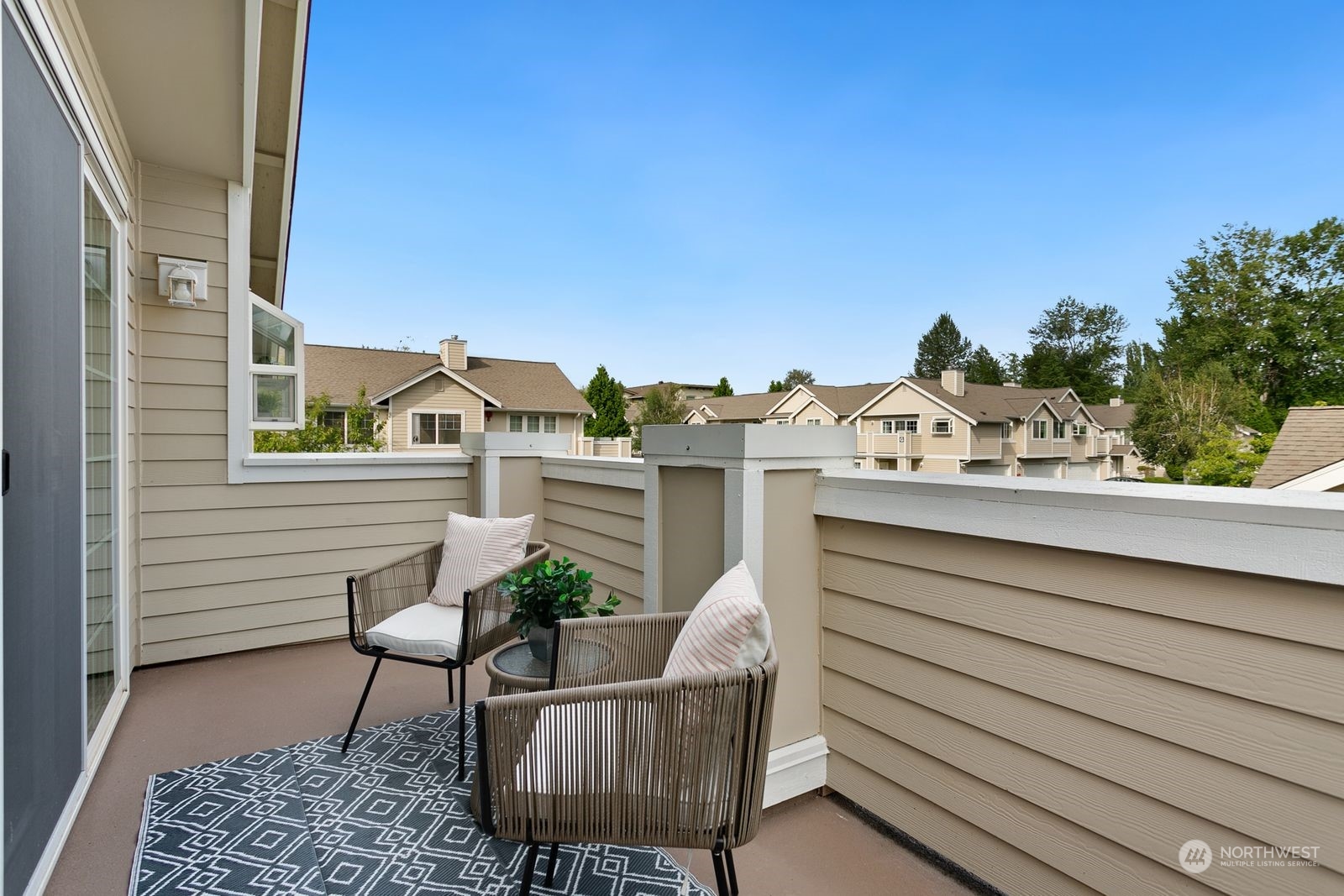 1522 196th Street Southeast, Unit C102 Bothell, WA 98012 - Photo 15 of 15 a view of a chair and table in the balcony