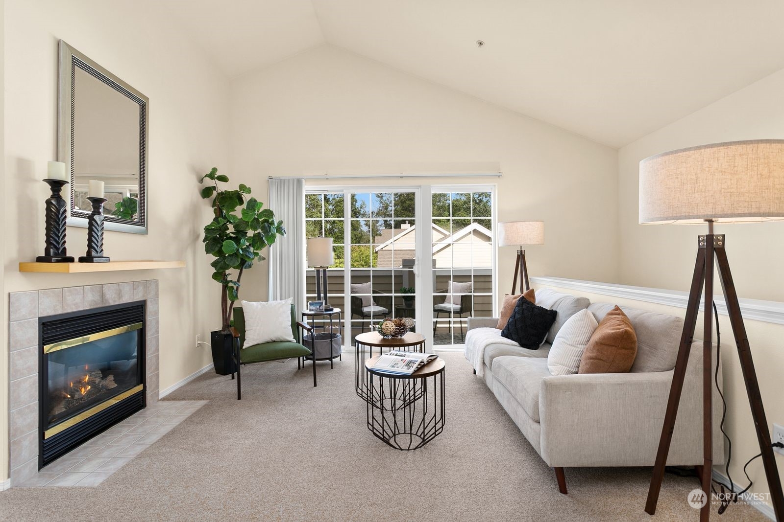 1522 196th Street Southeast, Unit C102 Bothell, WA 98012 - Photo 4 of 15 a living room with furniture and a fireplace