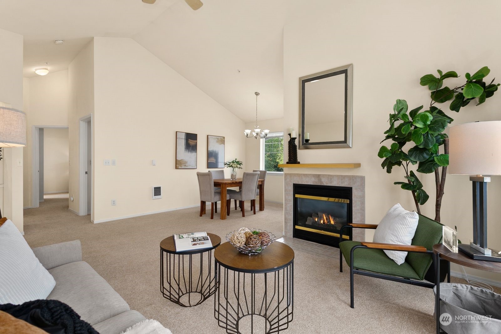 1522 196th Street Southeast, Unit C102 Bothell, WA 98012 - Photo 6 of 15 a living room with furniture potted plant and a fireplace