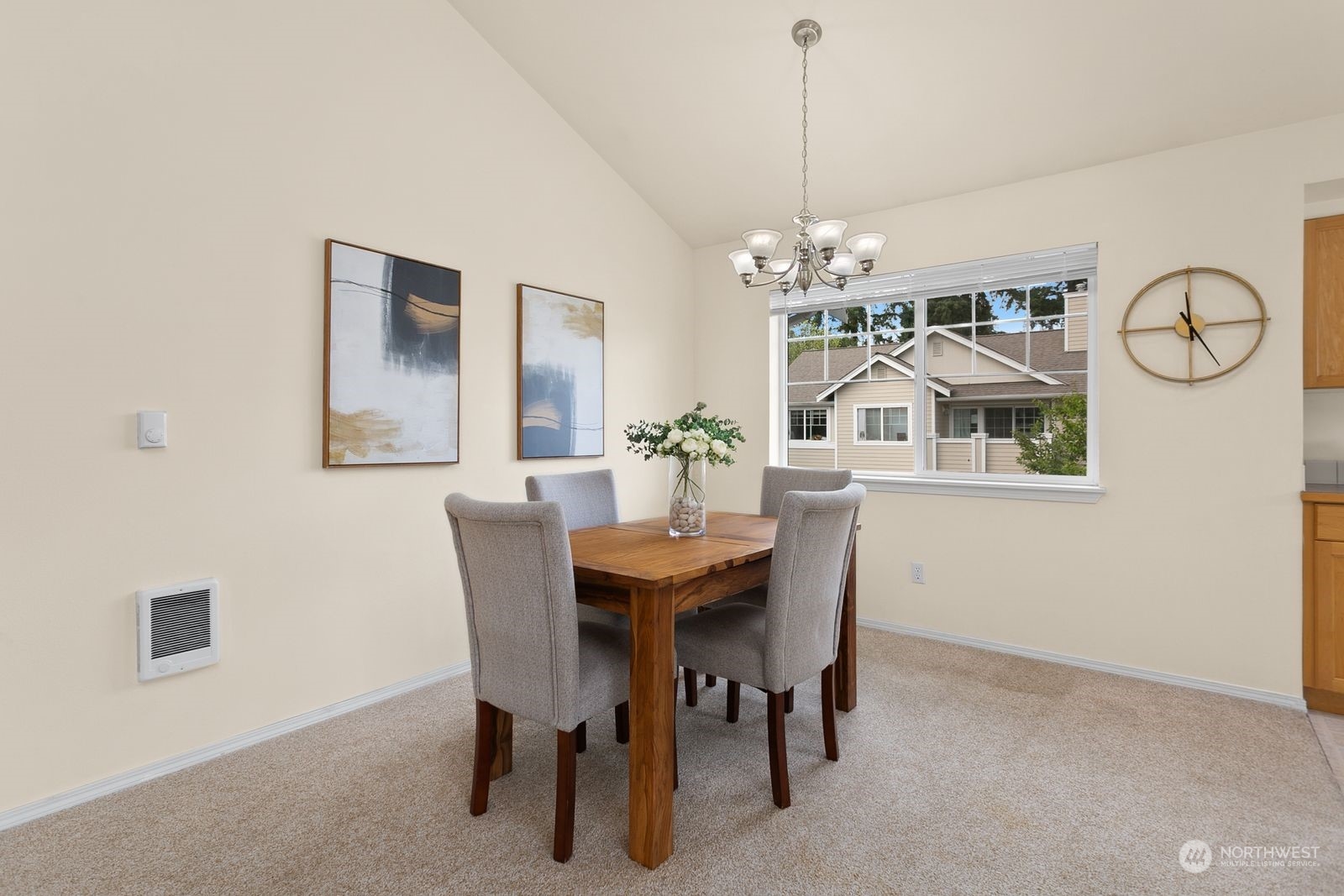 1522 196th Street Southeast, Unit C102 Bothell, WA 98012 - Photo 7 of 15 a dining room with furniture a chandelier and window