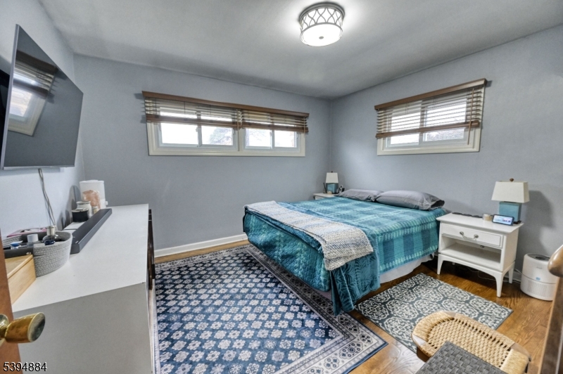 3313 Banta Road South Plainfield, NJ 07080 - Photo 6 of 13 a bedroom with a bed and a window