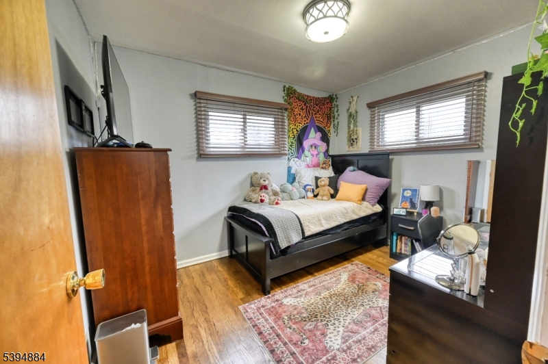3313 Banta Road South Plainfield, NJ 07080 - Photo 7 of 13 a bedroom with a bed and window
