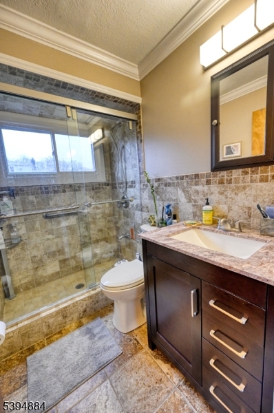 3313 Banta Road South Plainfield, NJ 07080 - Photo 8 of 13 a bathroom with a granite countertop sink toilet and shower