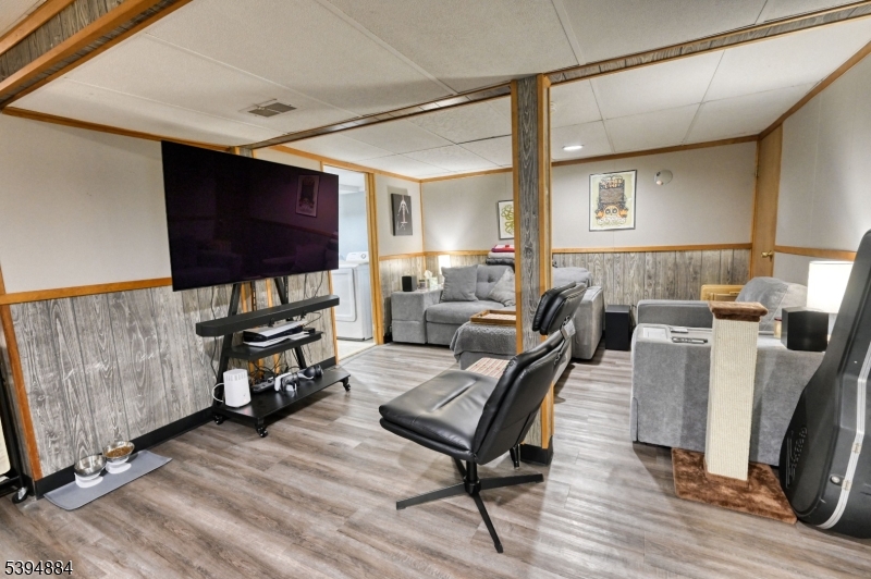 3313 Banta Road South Plainfield, NJ 07080 - Photo 10 of 13 a living room with furniture and a flat screen tv