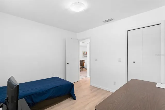 a room with a bed and cabinets