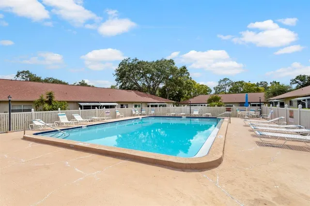 a view of a swimming pool with lounge chair