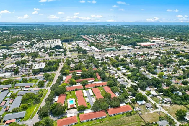 an aerial view of a house with a garden