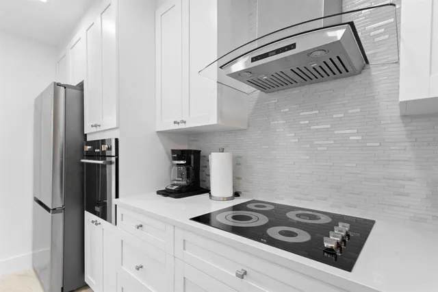 a kitchen with appliances and cabinets