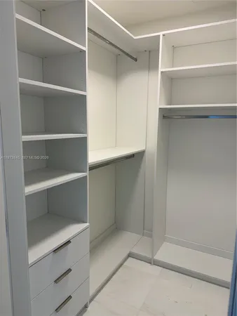 a bathroom with a glass door shower