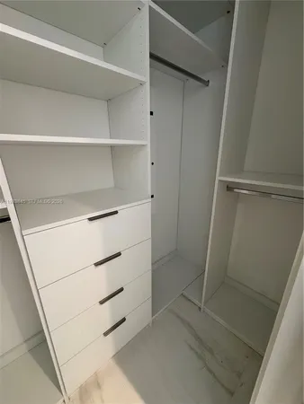 a view of an empty walk in closet