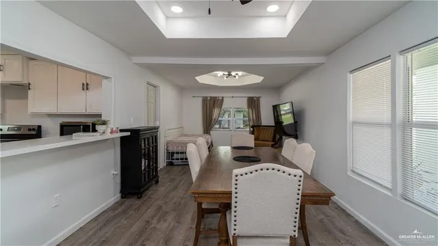 a large white kitchen with a large window