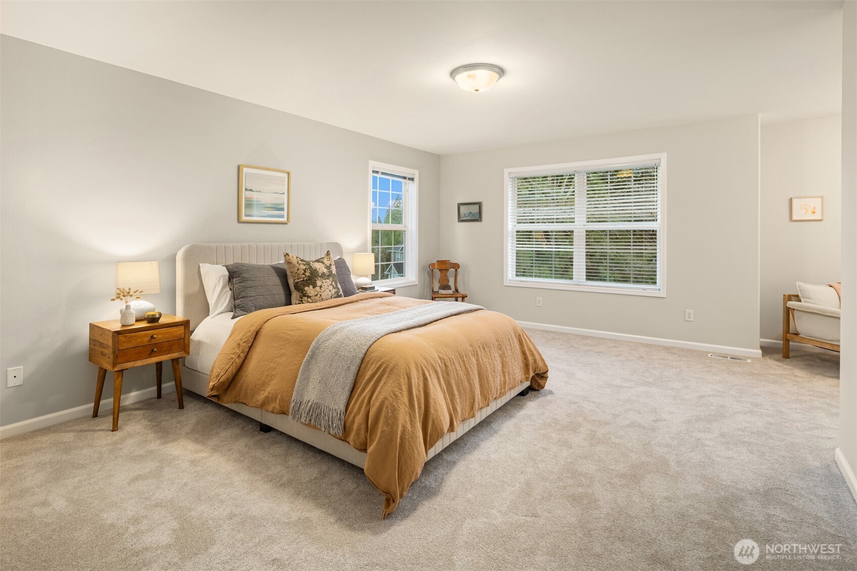 1402 Langara Circle Bellingham, WA 98229 - Photo 21 of 40 a spacious bedroom with a bed and a chair