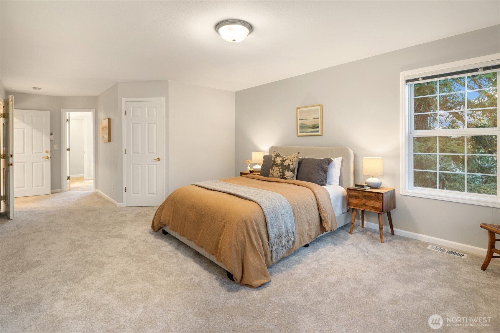 1402 Langara Circle Bellingham, WA 98229 - Photo 23 of 40 a spacious bedroom with a bed and a window