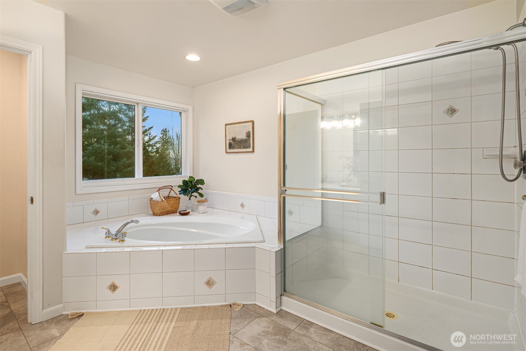 1402 Langara Circle Bellingham, WA 98229 - Photo 25 of 40 a bathroom with a tub a sink and a shower
