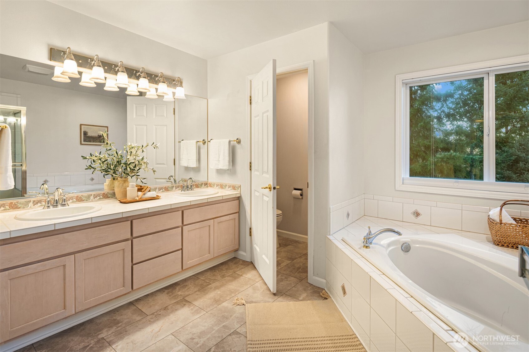 1402 Langara Circle Bellingham, WA 98229 - Photo 26 of 40 a spacious bathroom with a tub sink and mirror