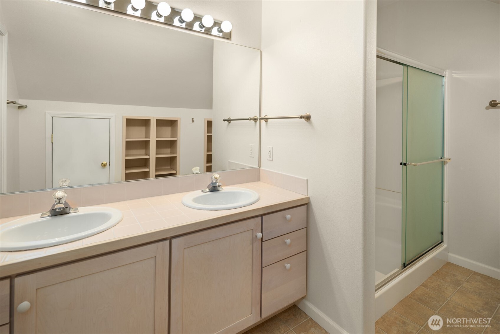 1402 Langara Circle Bellingham, WA 98229 - Photo 30 of 40 a bathroom with a sink and a mirror