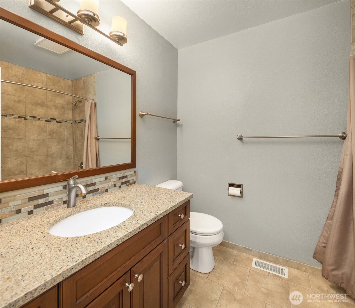 1402 Langara Circle Bellingham, WA 98229 - Photo 33 of 40 a bathroom with a granite countertop sink a toilet and a mirror