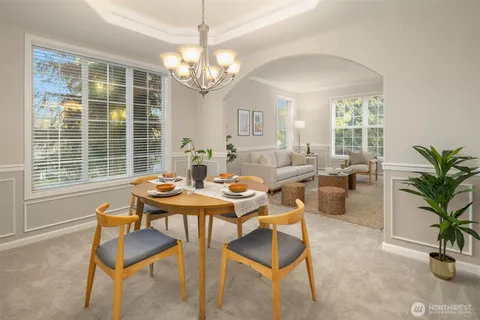 a view of a dining room with furniture window and outside view