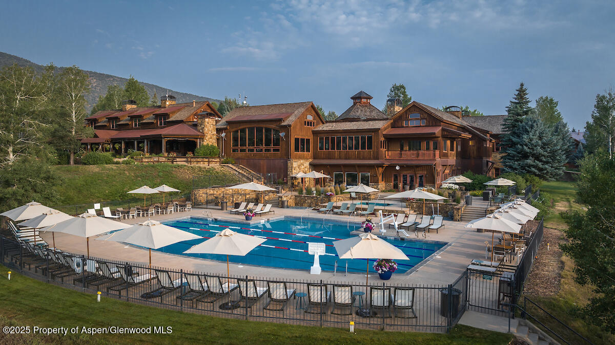 0 Midland Loop Carbondale, CO 81623 - Photo 15 of 17 a view of a house with pool and chairs