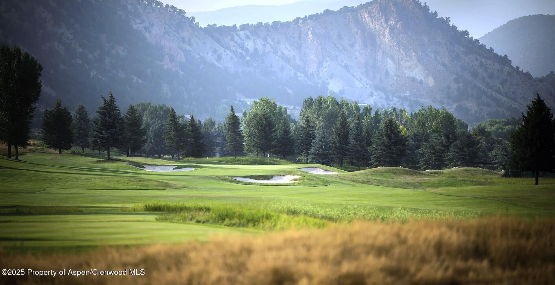 0 Midland Loop Carbondale, CO 81623 - Photo 8 of 17 a swimming pool with outdoor seating and trees