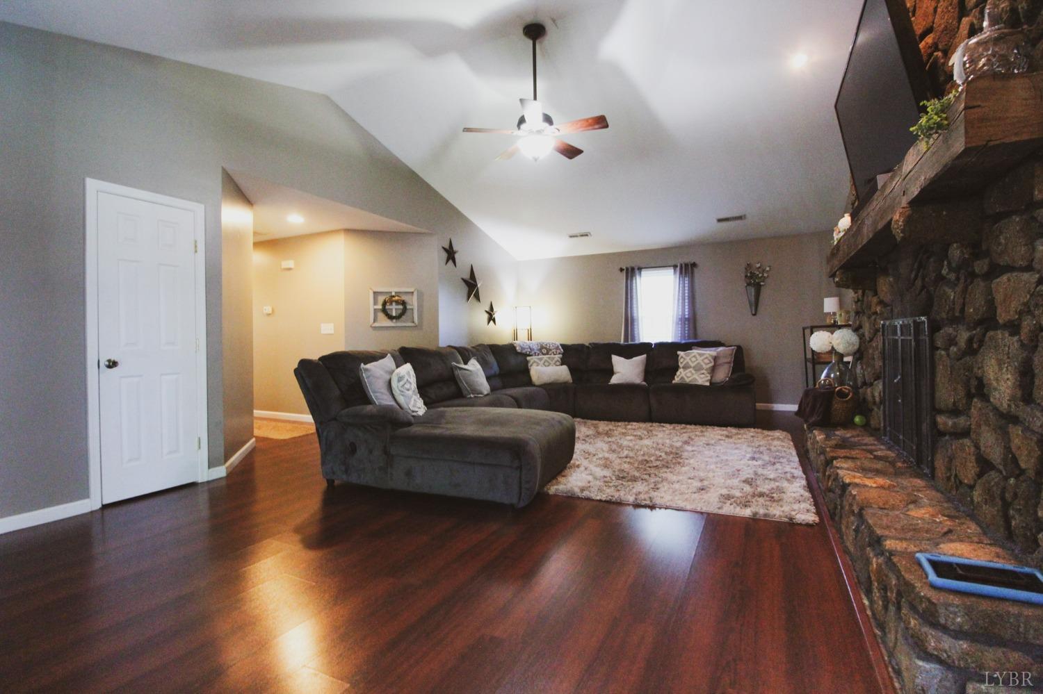 1217 Wood Road Lynchburg, VA 24502 - Photo 11 of 29 a living room with furniture and wooden floor