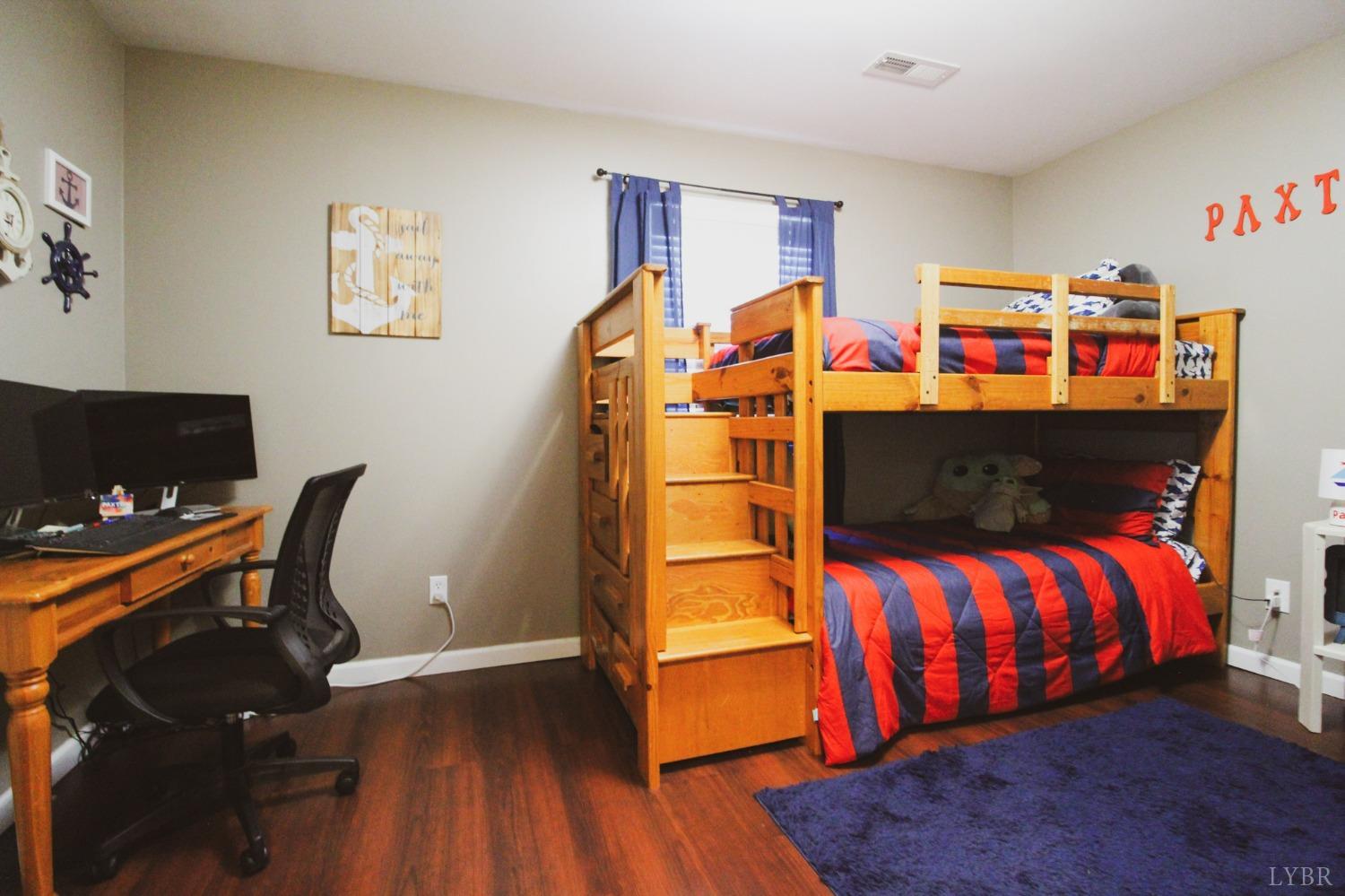 1217 Wood Road Lynchburg, VA 24502 - Photo 13 of 29 a bedroom with a bed and wooden floor