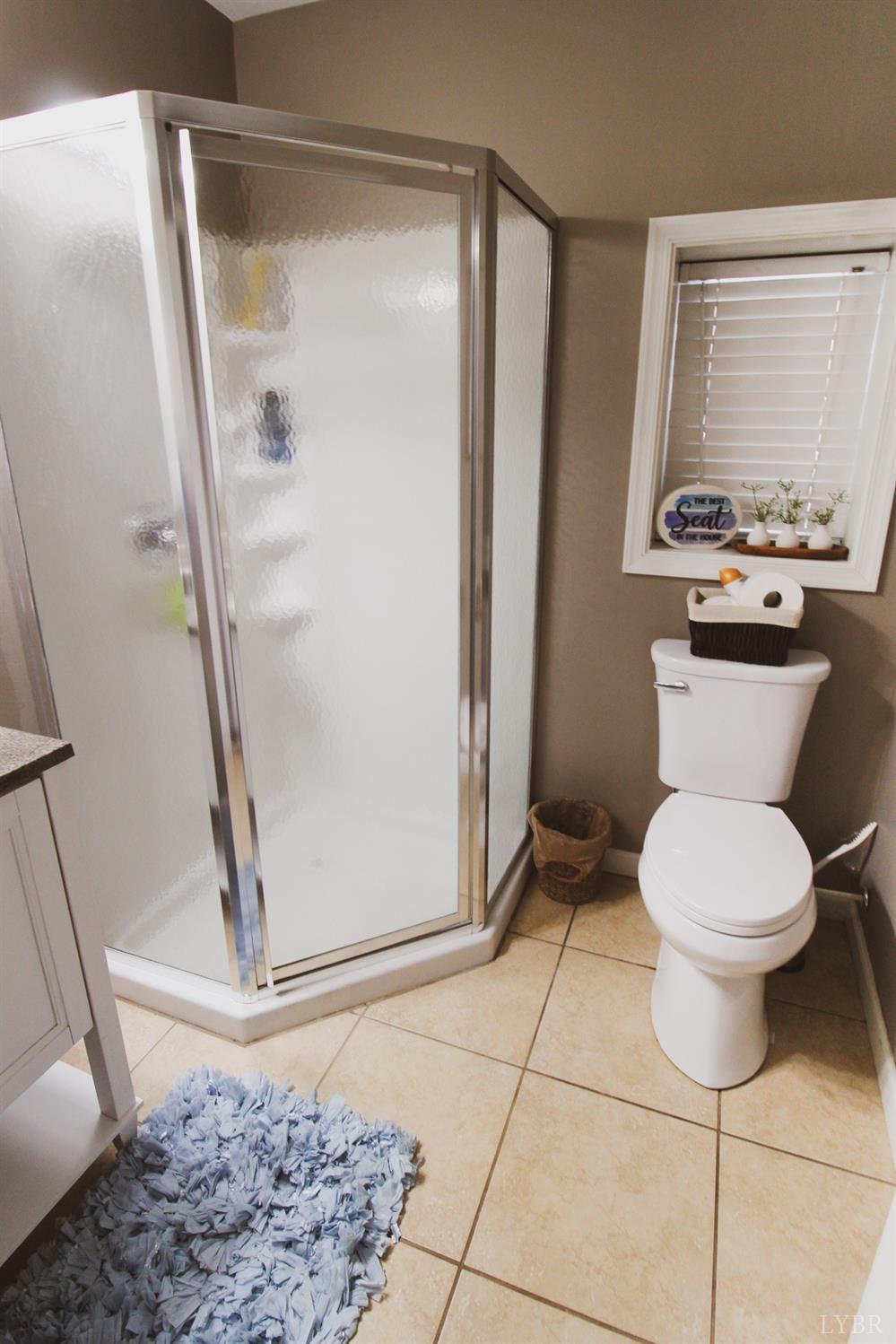 1217 Wood Road Lynchburg, VA 24502 - Photo 15 of 29 a bathroom with a toilet and a shower