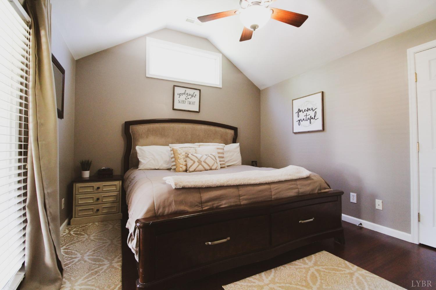 1217 Wood Road Lynchburg, VA 24502 - Photo 17 of 29 a bedroom with a bed and a painting on the wall