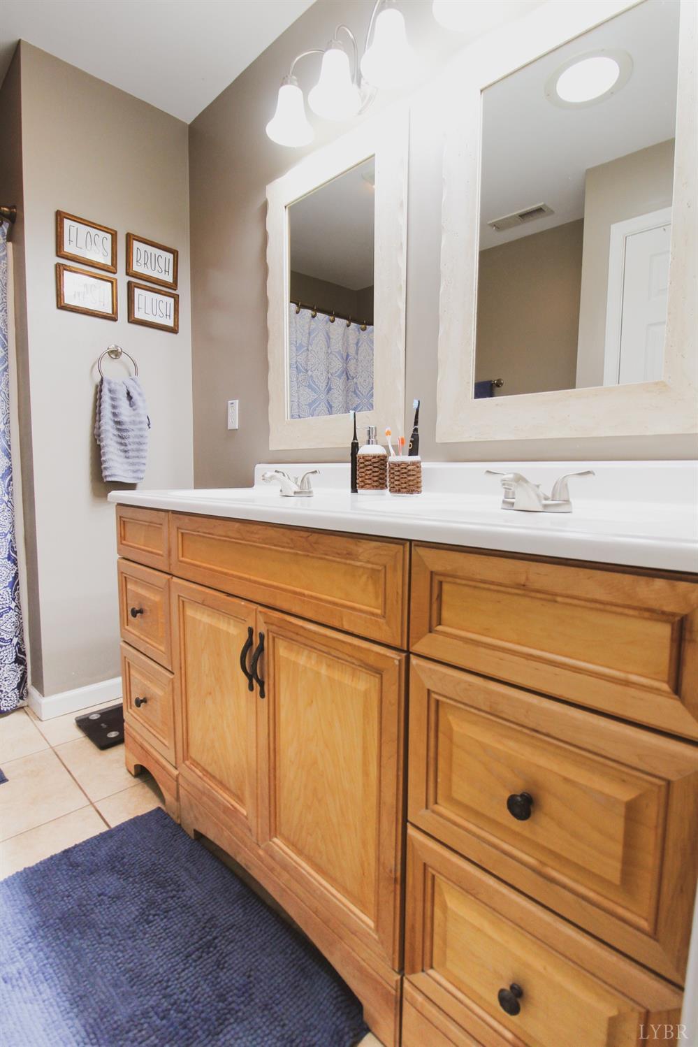 1217 Wood Road Lynchburg, VA 24502 - Photo 19 of 29 a bathroom with a sink and a mirror