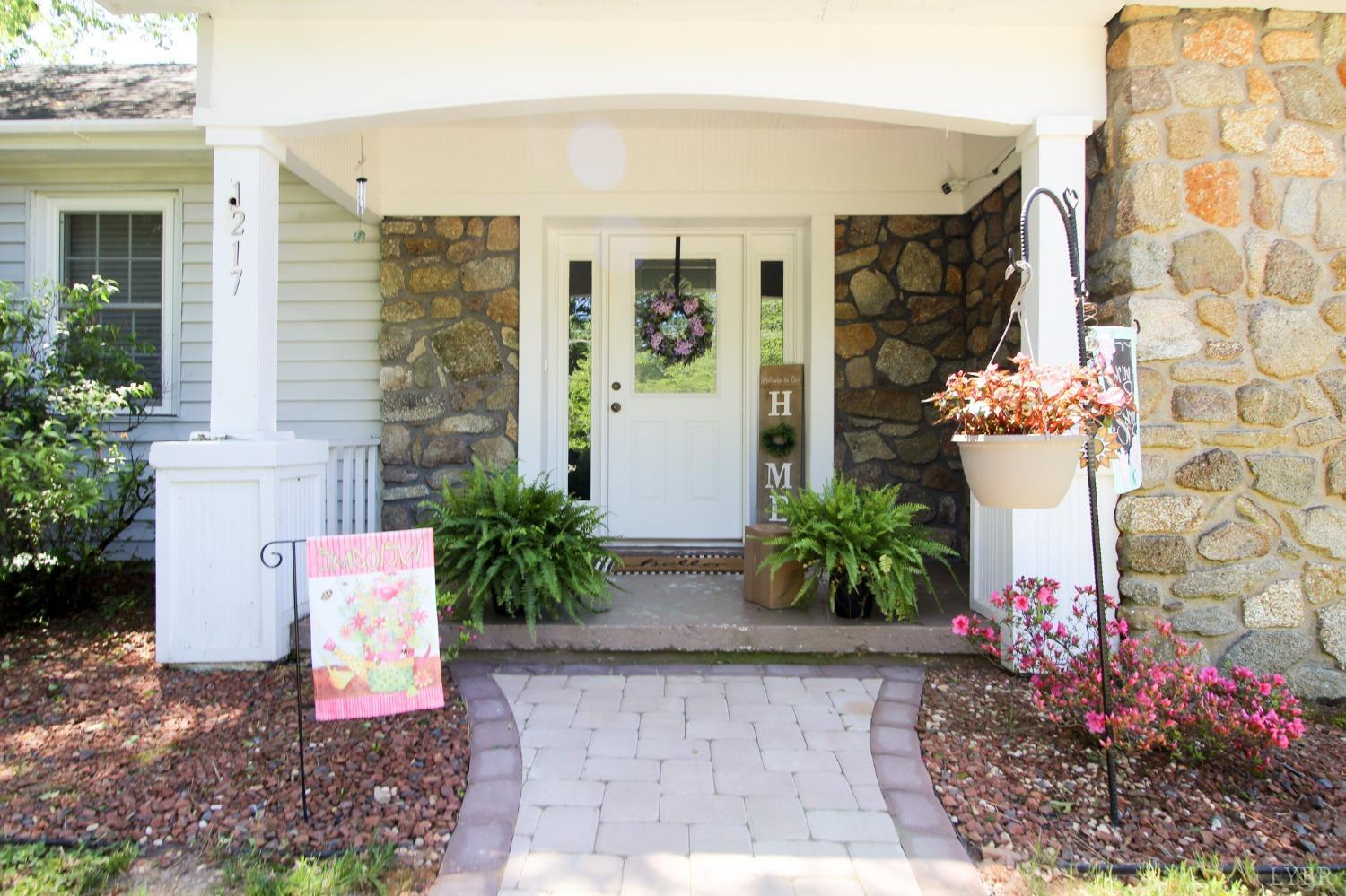 1217 Wood Road Lynchburg, VA 24502 - Photo 2 of 29 a potted plant sitting in front of a house
