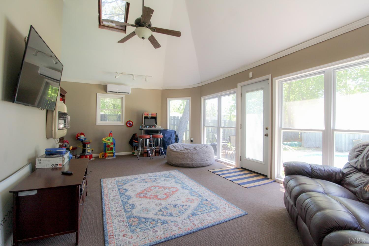 1217 Wood Road Lynchburg, VA 24502 - Photo 21 of 29 a living room with furniture and a flat screen tv