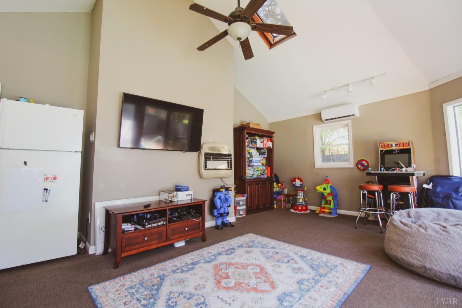 1217 Wood Road Lynchburg, VA 24502 - Photo 23 of 29 a bedroom with furniture and a flat screen tv