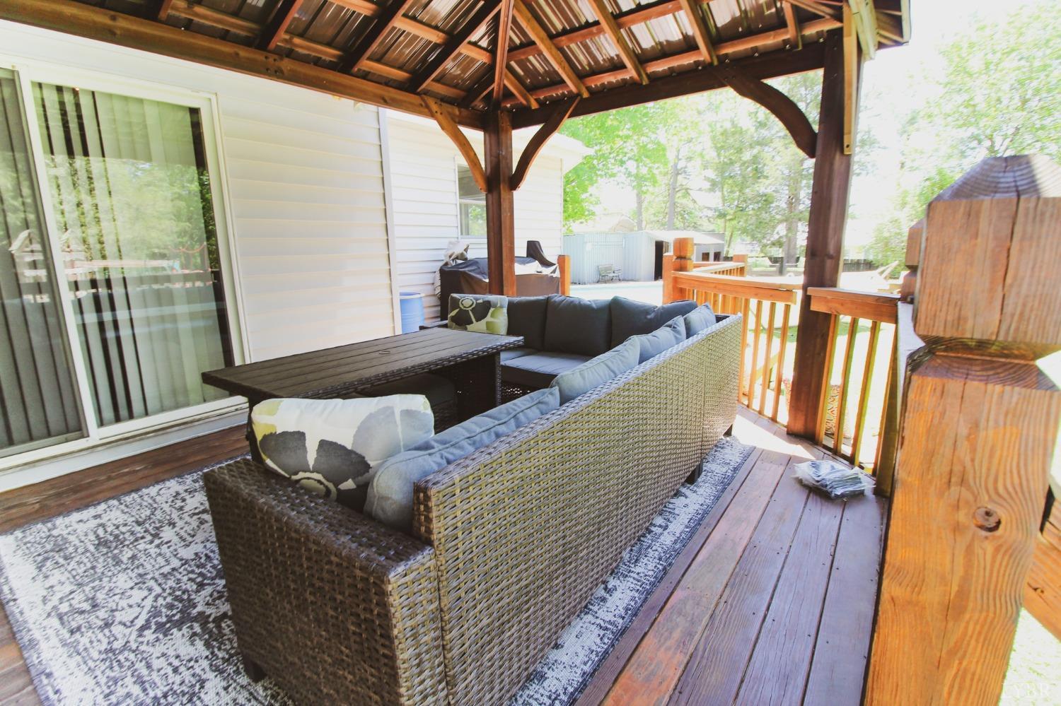 1217 Wood Road Lynchburg, VA 24502 - Photo 27 of 29 a living room with furniture and a floor to ceiling window