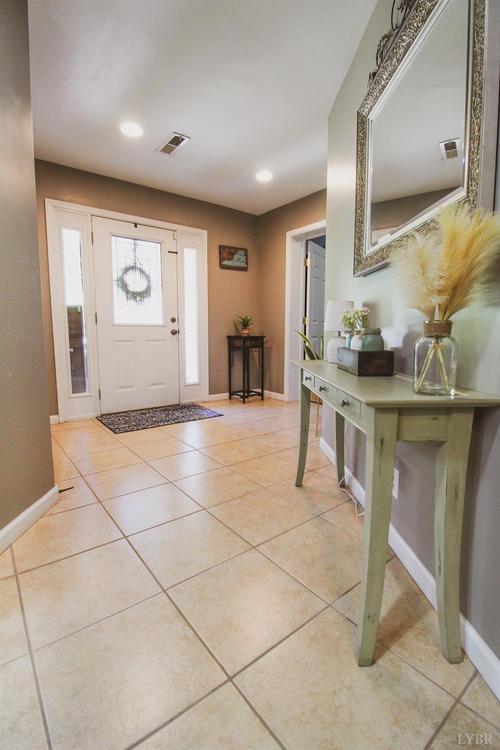 1217 Wood Road Lynchburg, VA 24502 - Photo 6 of 29 a view of a kitchen with furniture and a window