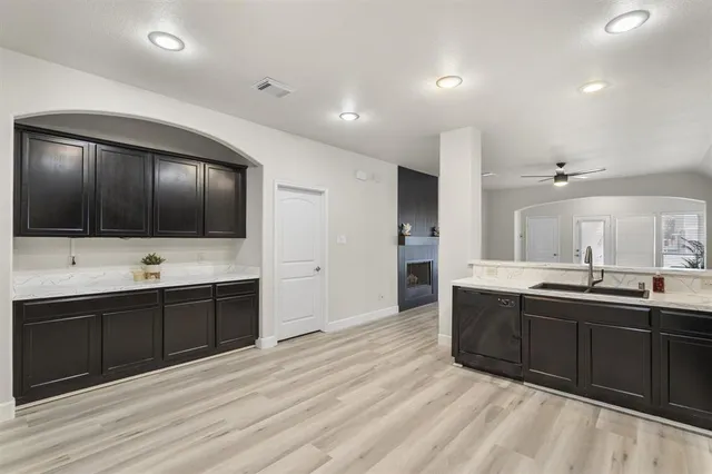 a large bathroom with double vanity and a large mirror