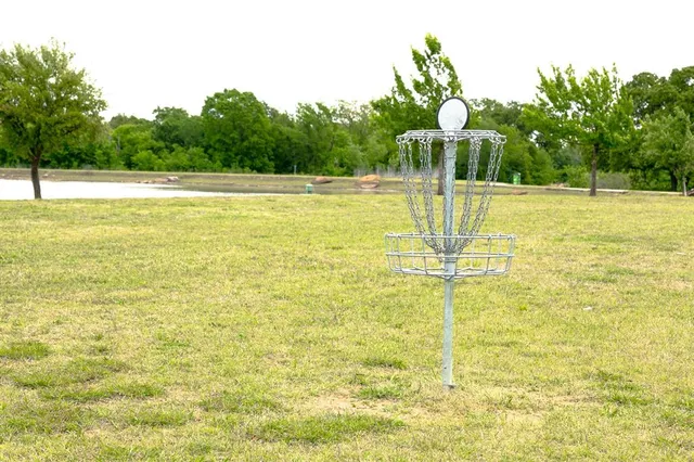 a view of a lake with houses in the background