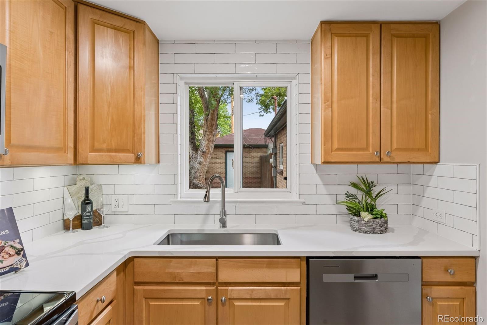 2255 Meade Street Denver, CO 80211 - Photo 10 of 30 a kitchen with appliances cabinets and a sink