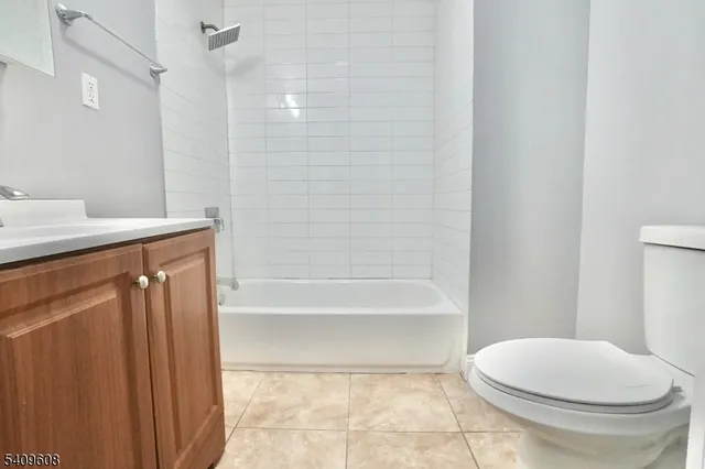 a bathroom with a toilet and a bathtub