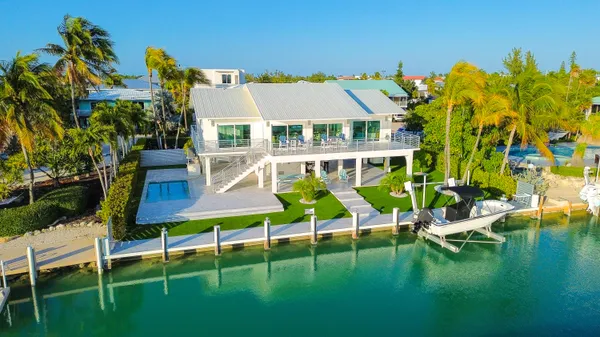 a kitchen with lots of counter top space and stainless steel appliances