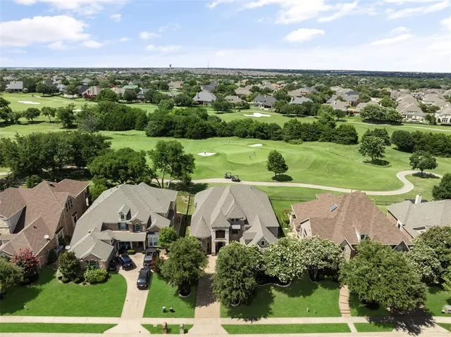 an aerial view of a house with a garden